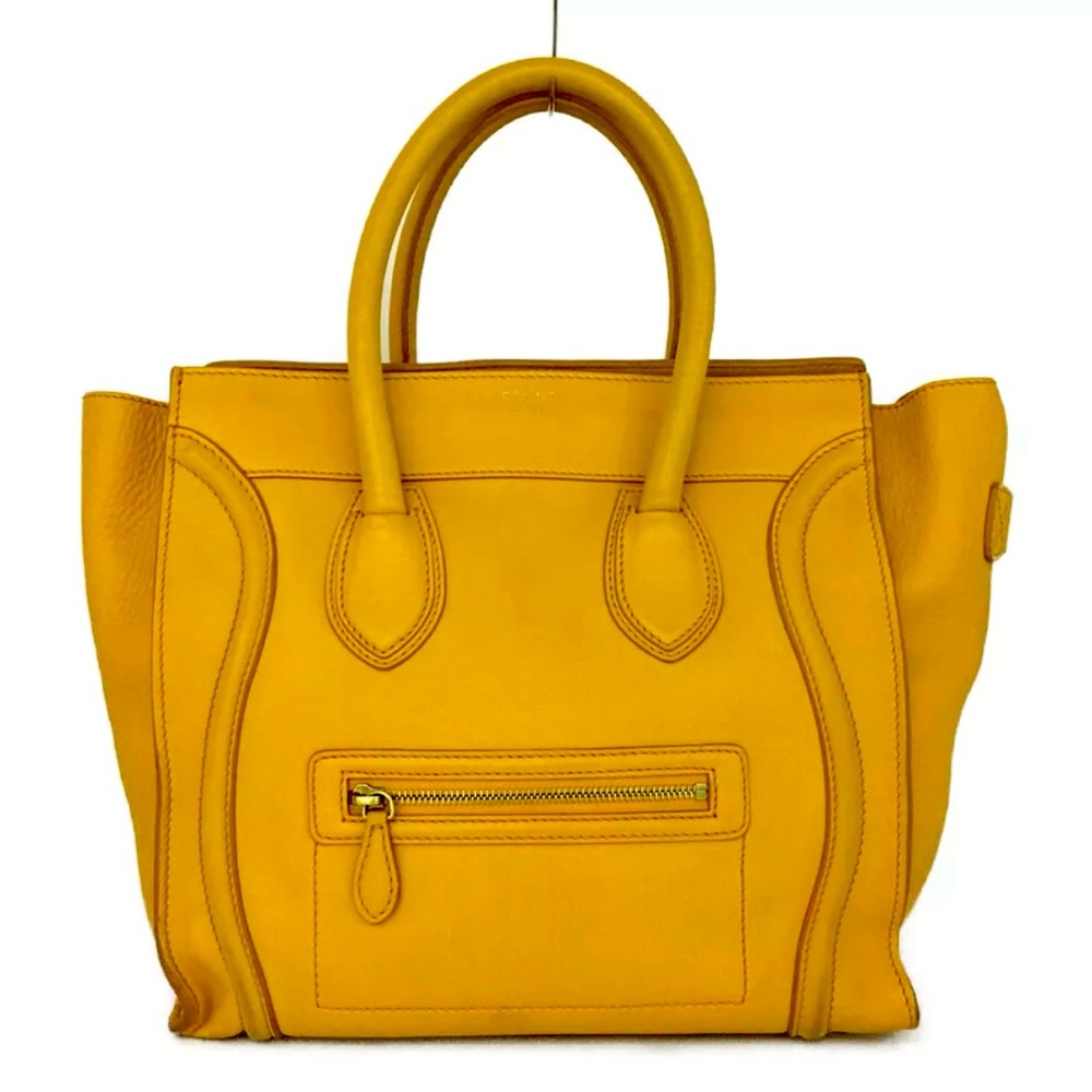 Authentic Micro Luggage Handbag In Drummed Calfskin comes with dustbag.